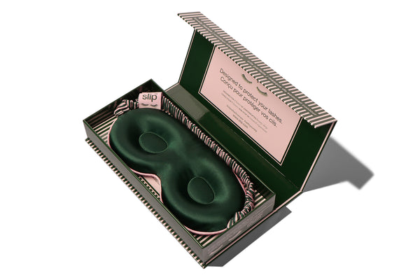 Green contour sleep mask in a decorative box with a pink label on a white background