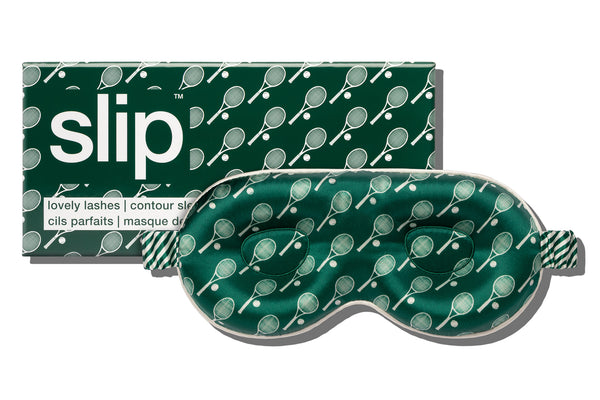 Green silk contour sleep mask with tennis racket pattern and 'slip' packaging on a white background