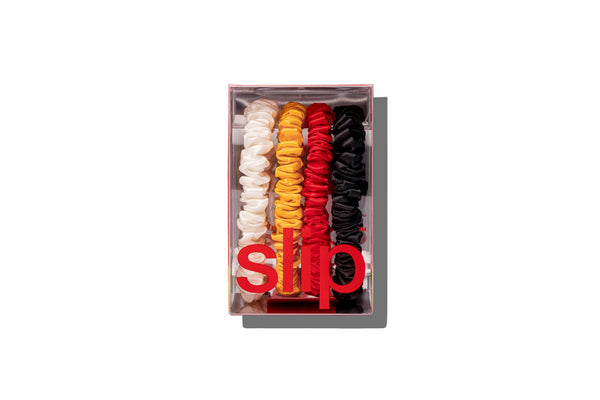 Set of colorful scrunchies in a box with slip® branding on a white background