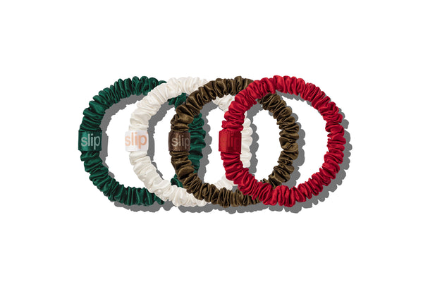 Set of four colorful hair ties on a white background