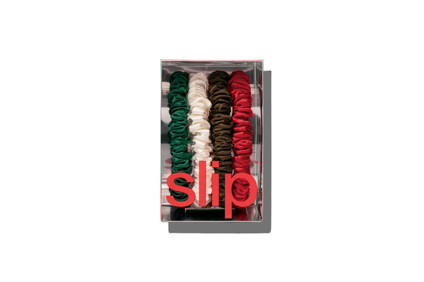 Set of colorful hair ties in a clear box with 'slip' branding on a white background