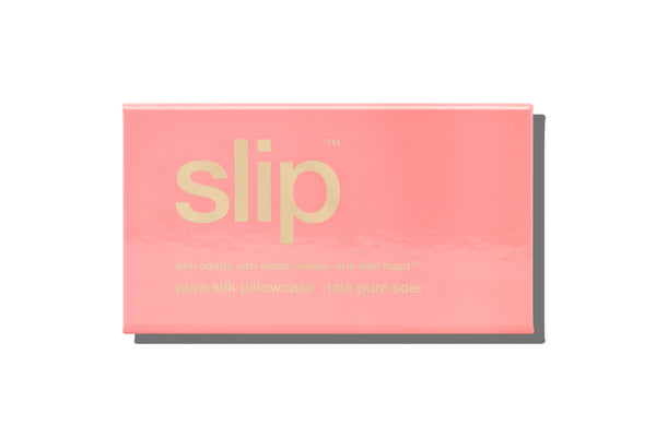 A blush pink queen-sized zippered pillowcase with piping and an invisible zipper closure.