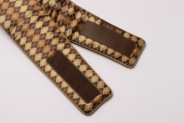 Slip Blockout Sleep Mask in a  brown and beige argyle pattern, featuring adjustable  hook-and-loop closures.