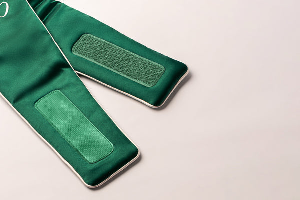 Up close of green hook and loop or 'velcro' fastening of the blockout sleep mask.