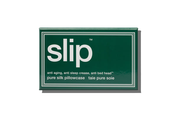 Green packaging of 'slip' pure silk pillowcase on a white background