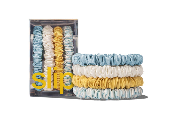 Set of colorful hair ties with packaging labeled 'slip' on a white background