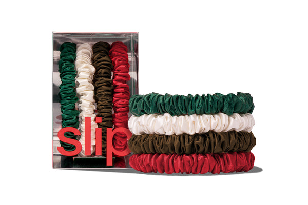 Set of colorful hair scrunchies with 'slip' packaging on a white background