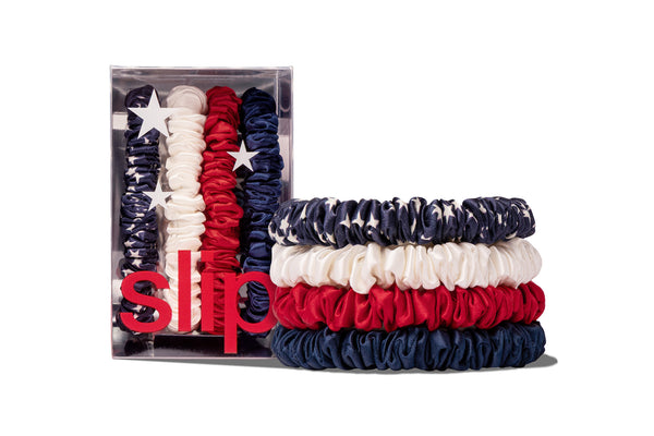 Set of hair scrunchies in red, white, and blue with a clear box packaging.