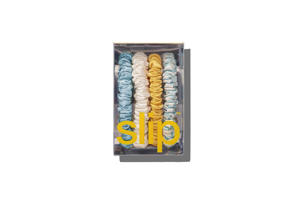 Set of spiral hair ties in a clear box with 'slip' branding on a white background